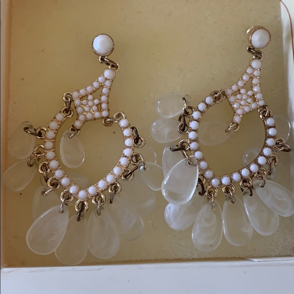 White dangly earrings